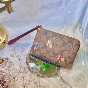 COACH Corner Zip Wristlet in Signature Coated Canvas with Cat Mittens Print